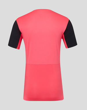 Pink and black short-sleeve shirt on a gray background