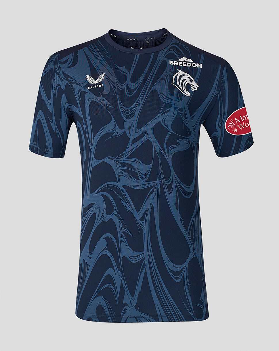 Front view of a navy Leicester Tigers junior 2026/27 matchday T-shirt with crest and Castore branding in a blue swirl pattern