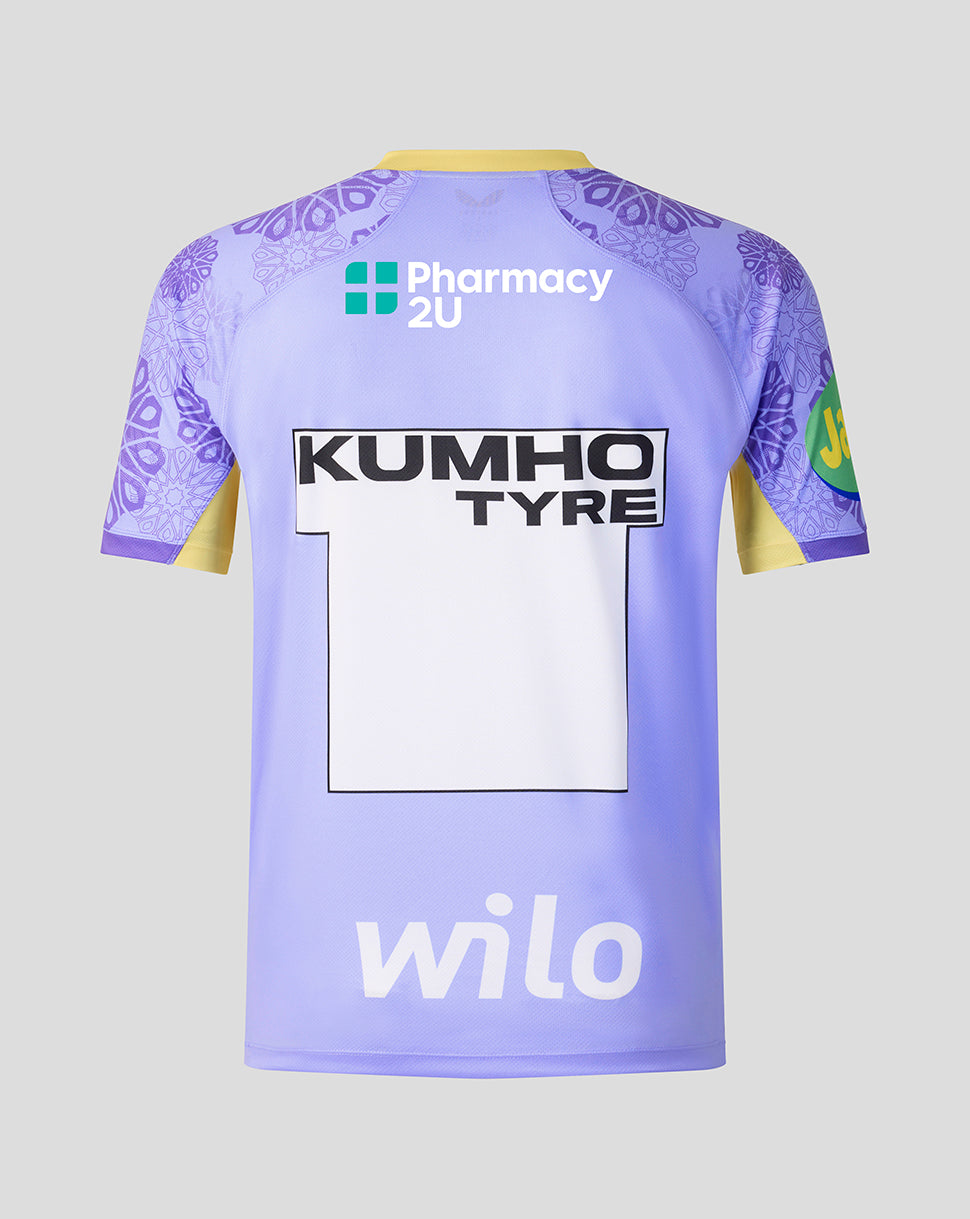 Close up of Leicester Tigers Women's 2026/27 Away Replica Shirt fabric showing purple pattern and bright green curved panel with yellow lettering.