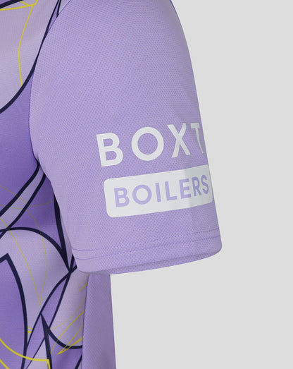 Close-up of a lavender-purple short-sleeve athletic jersey sleeve with a white BOXT BOILERS logo on the upper arm, set against a light gray background.