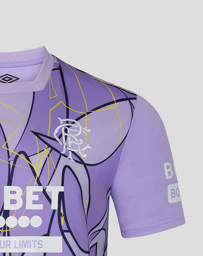 Purple sports jersey with geometric patterns and branding on a light gray background