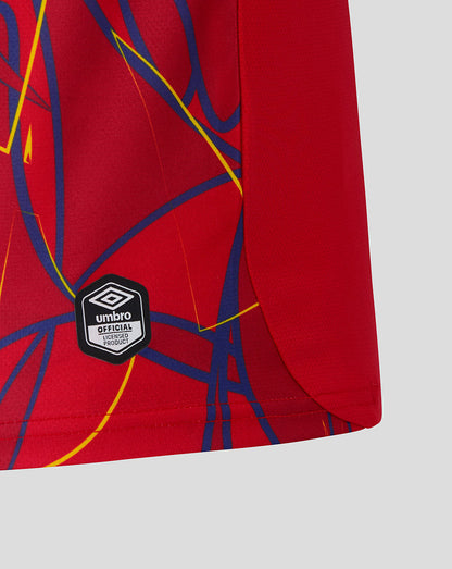 Red shorts with blue and yellow abstract design and Umbro logo on a light gray background