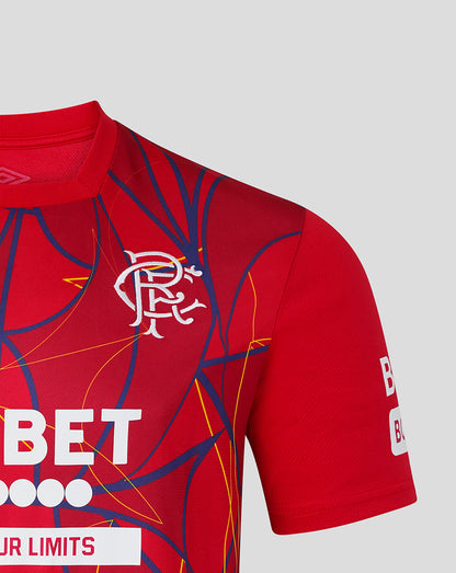 Red sports jersey with blue and yellow patterns on a gray background