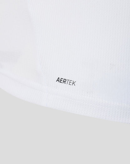 Close up of white knit fabric with AERTEK branding near the hem of the away shirt