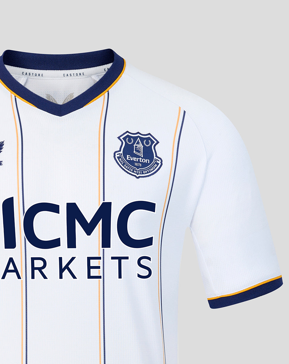 Close up of Everton crest on white away shirt with navy collar and vertical stripes