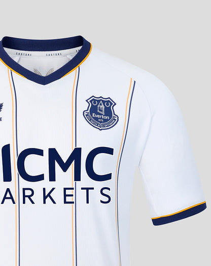 Close up of Everton crest on white away shirt with navy collar and vertical stripes