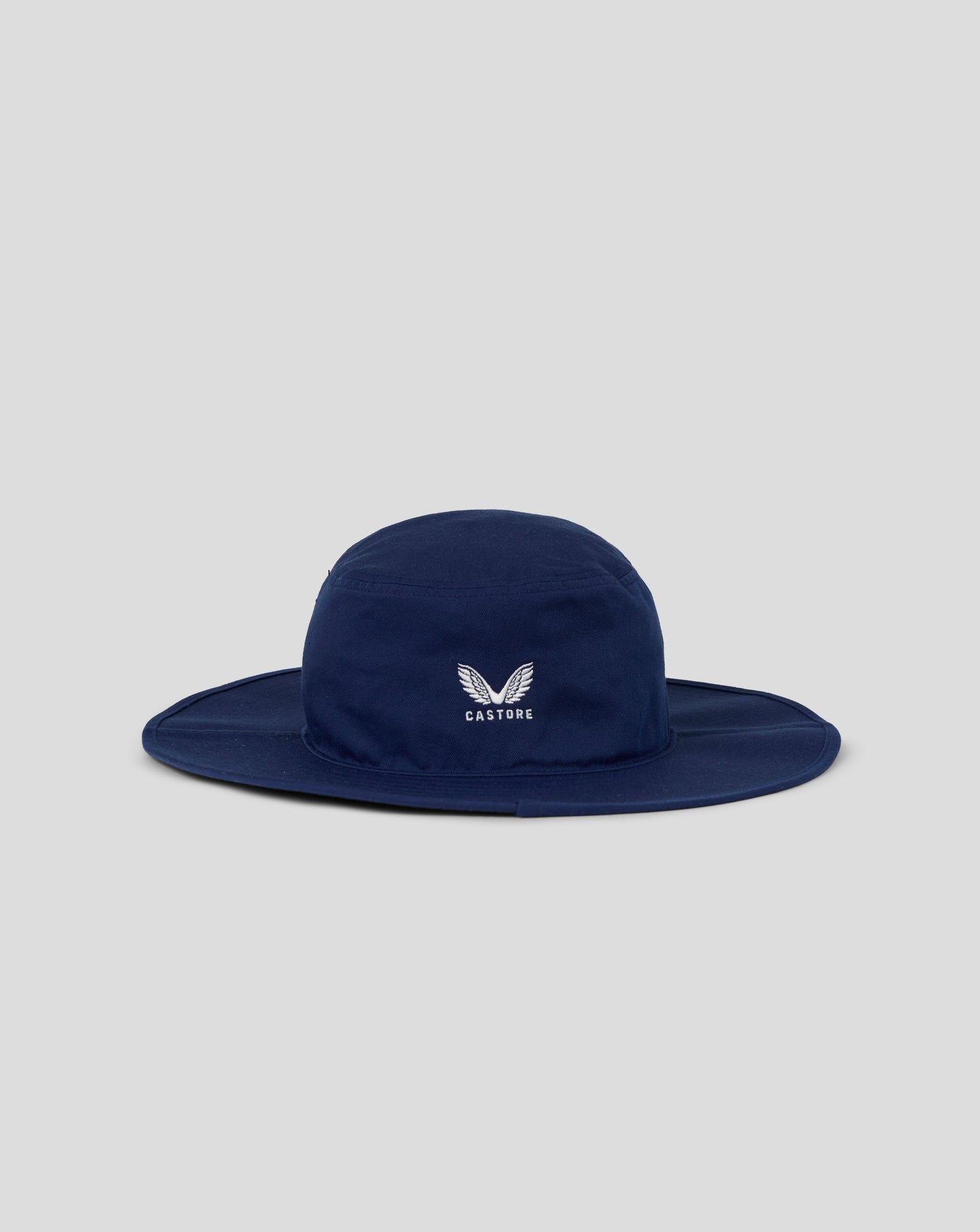 Navy blue bucket hat with a logo on a light gray background
