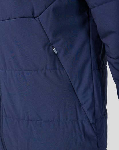 Close-up of a navy blue jacket with a zipper on a light gray background