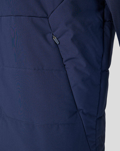 Close-up of a navy blue jacket with a zipper on a light gray background