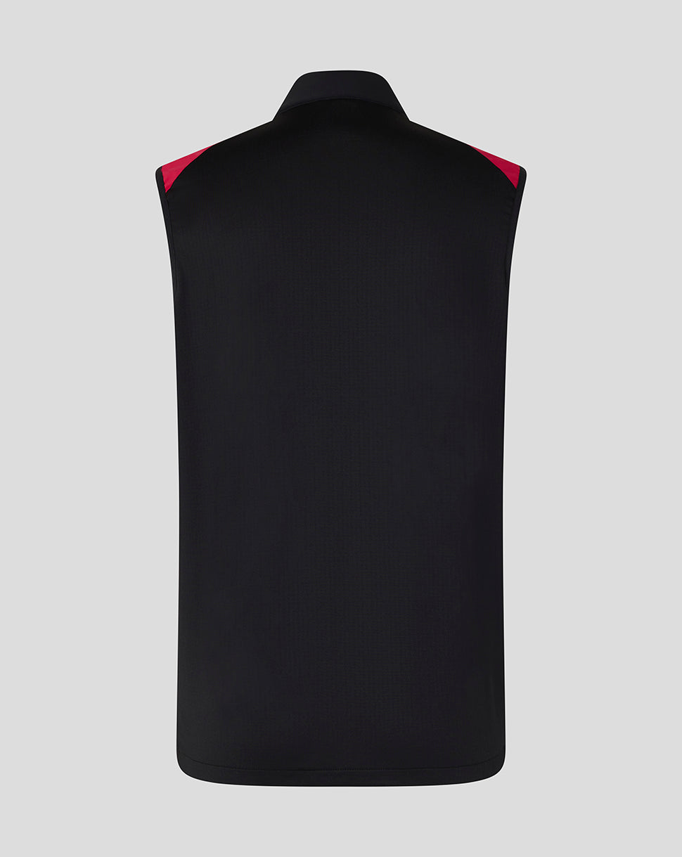 Black vest with red accents on a gray background