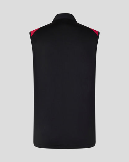 Black vest with red accents on a gray background