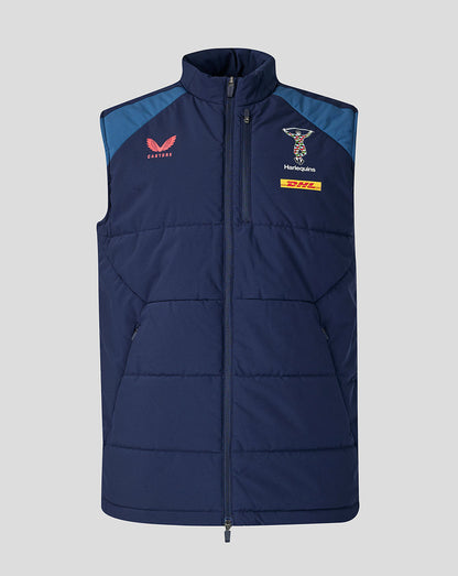 Navy blue puffer vest with logos on a light gray background