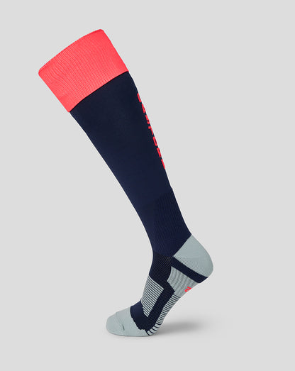 Navy knee-high sock with pink top and gray toe on a light gray background