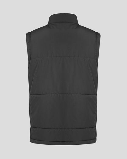 Black puffer vest on a light gray background