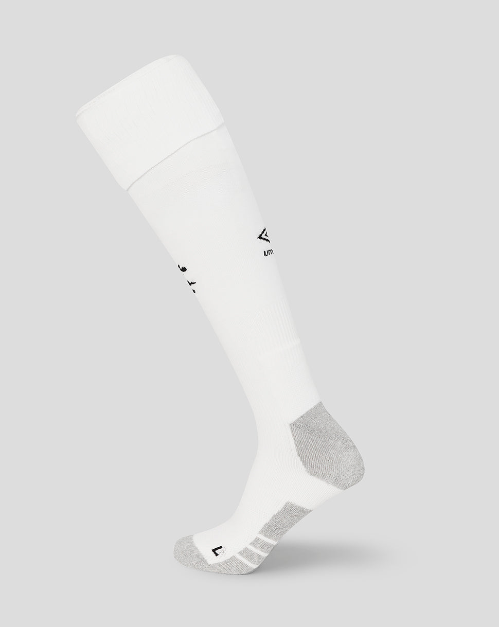 White knee-high sock with a small logo on a light gray background