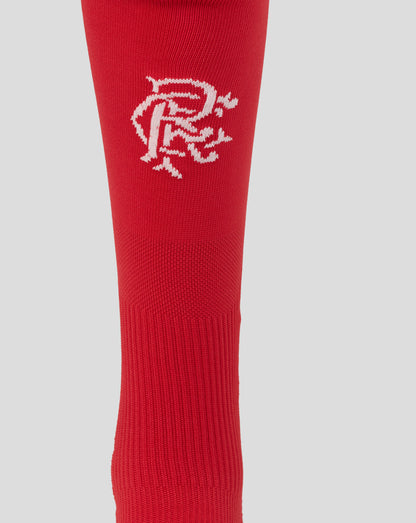 Red sock with a white logo on a light gray background