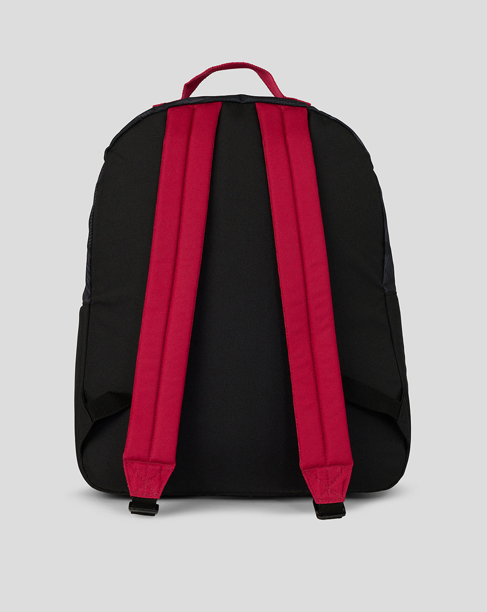 Black backpack with red straps on a light gray background