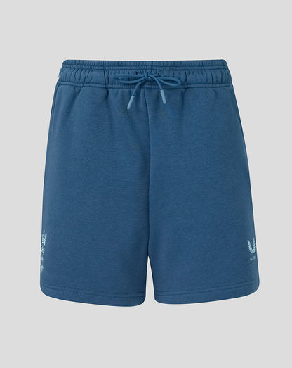 Blue shorts with a brand logo on a light gray background