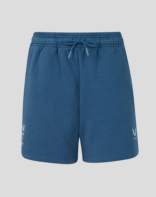 Blue shorts with a brand logo on a light gray background