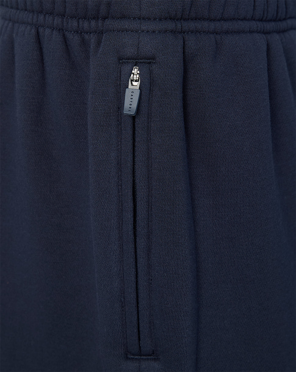 Navy blue sweatpants with a zipper pocket on a plain background