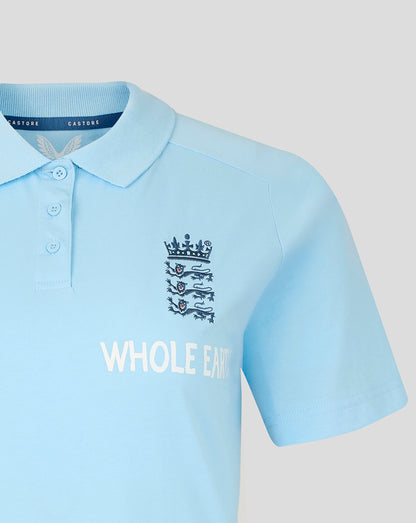 Light blue polo shirt with a logo and text on a light gray background