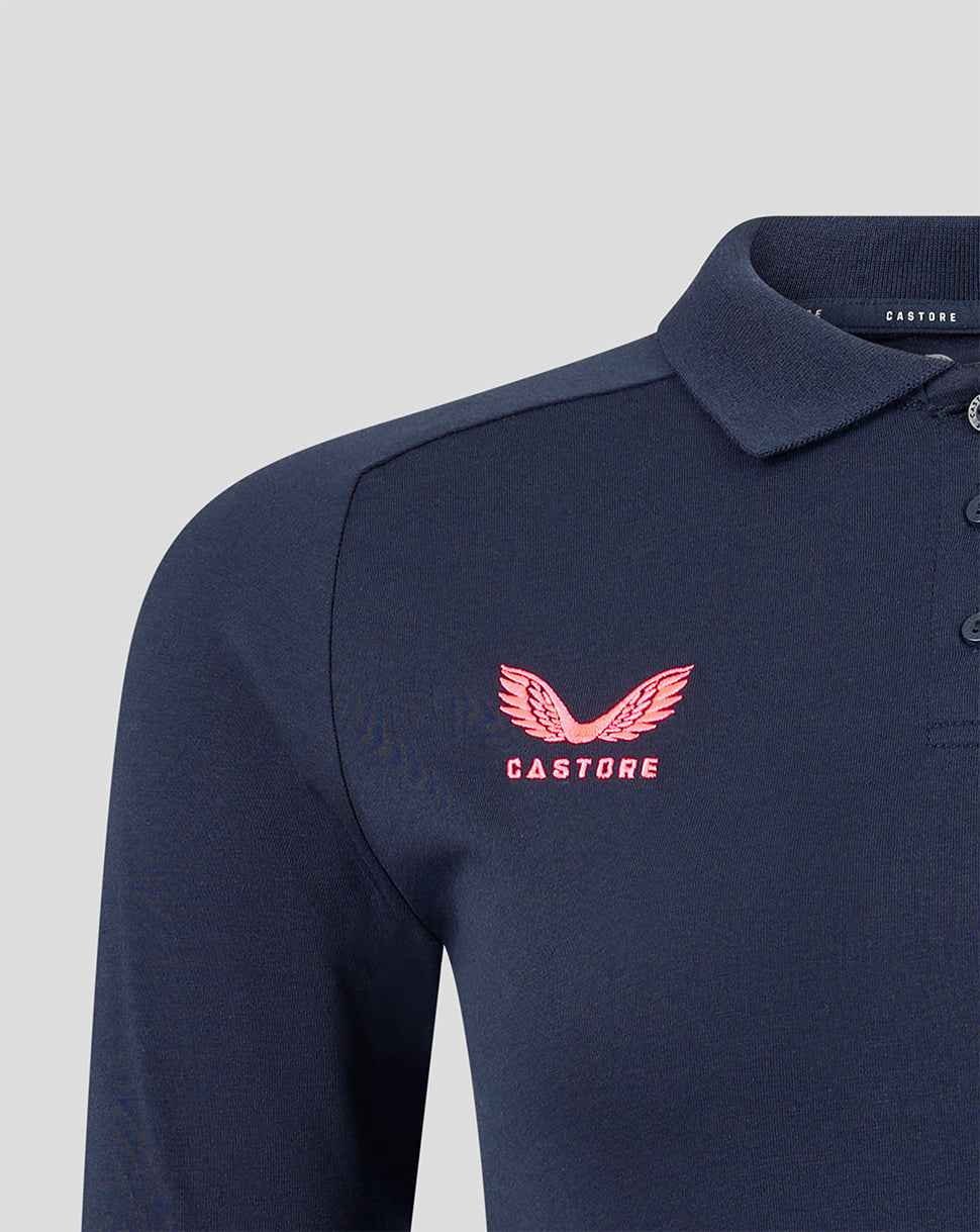 Navy polo shirt with pink logo on a light gray background