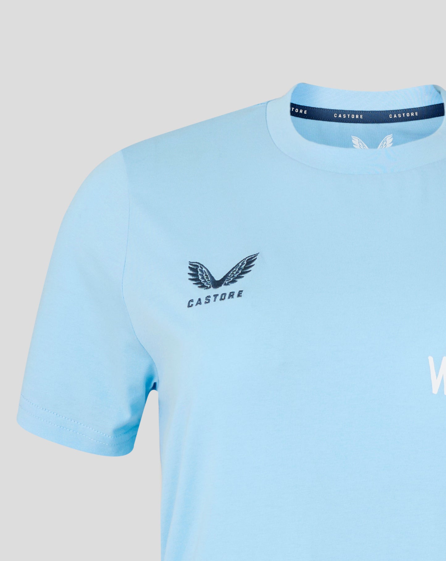 Light blue t-shirt with 'Castore' logo on a gray background
