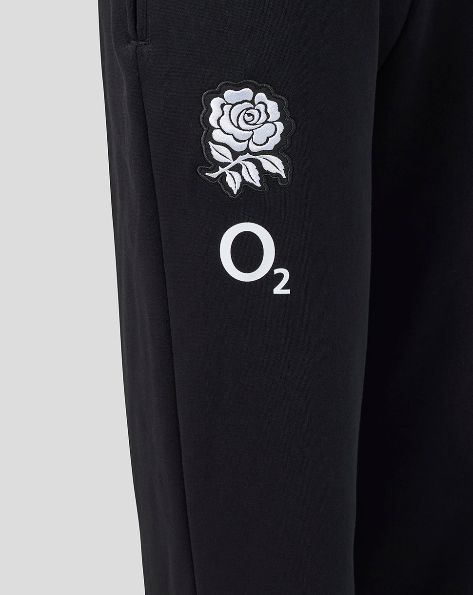 Black pants with white rose emblem and 'O2' logo on a light gray background