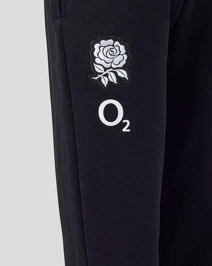 Black pants with white rose emblem and 'O2' logo on a light gray background