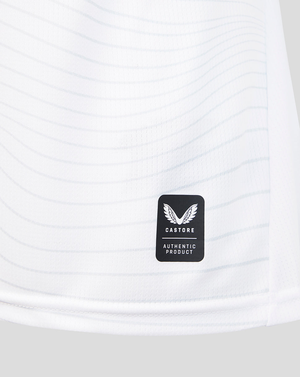Close-up of a white athletic shirt with a Castore logo on a white background