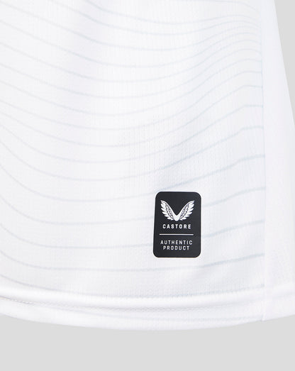 Close-up of a white athletic shirt with a Castore logo on a white background