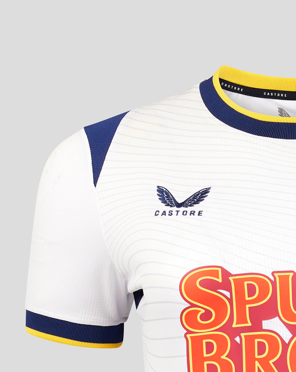 White sports jersey with blue and yellow accents and 'Castore' branding on a gray background.