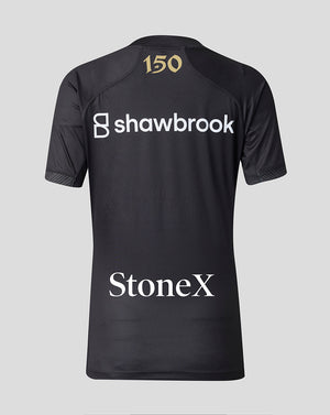 Back view of Saracens 2026/27 shirt in dark fabric with gold 150 emblem at the neck and Shawbrook and StoneX branding.