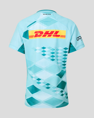 Back view of turquoise Harlequins 2026/27 Women's Away Pro Shirt with large DHL logo across the back and We Are True at the neckline.