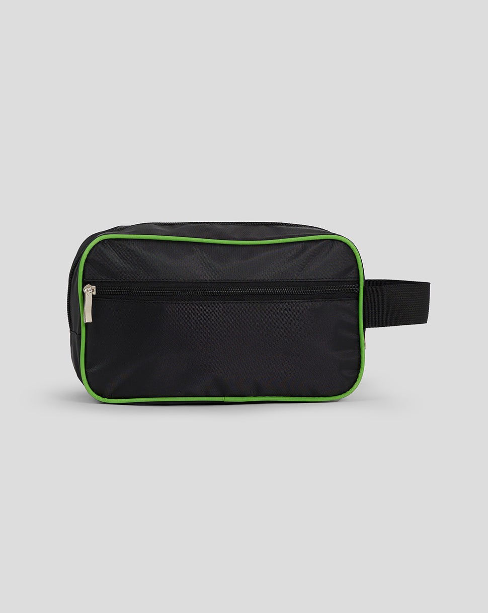 Black toiletry bag with green accents on a light gray background
