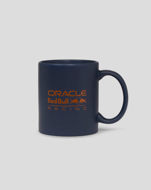 Dark blue mug with orange Oracle Red Bull Racing logo and a left side handle.
