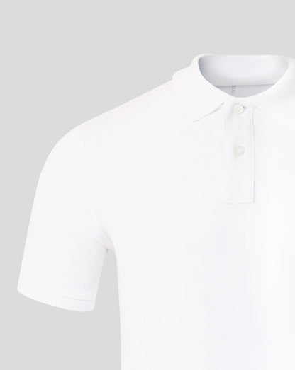 White polo shirt on a light gray background