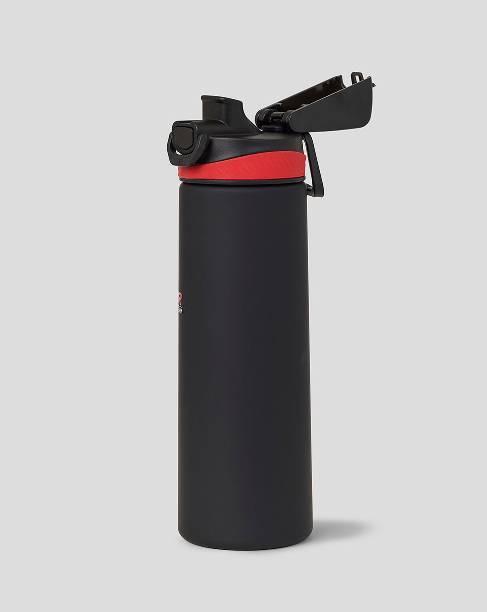 Black water bottle with a red band on a light gray background