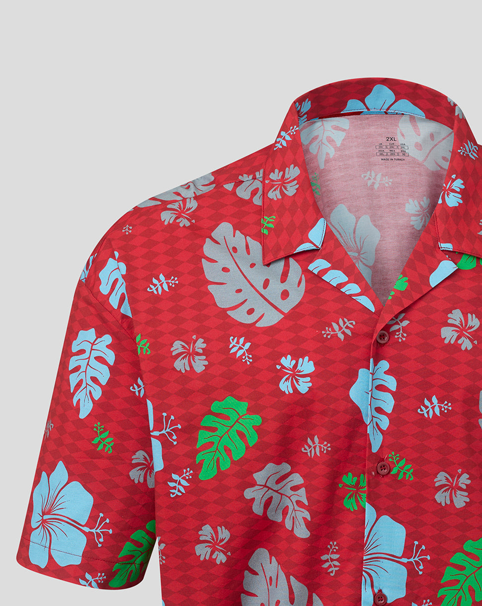 Red shirt with tropical leaf pattern on a white background