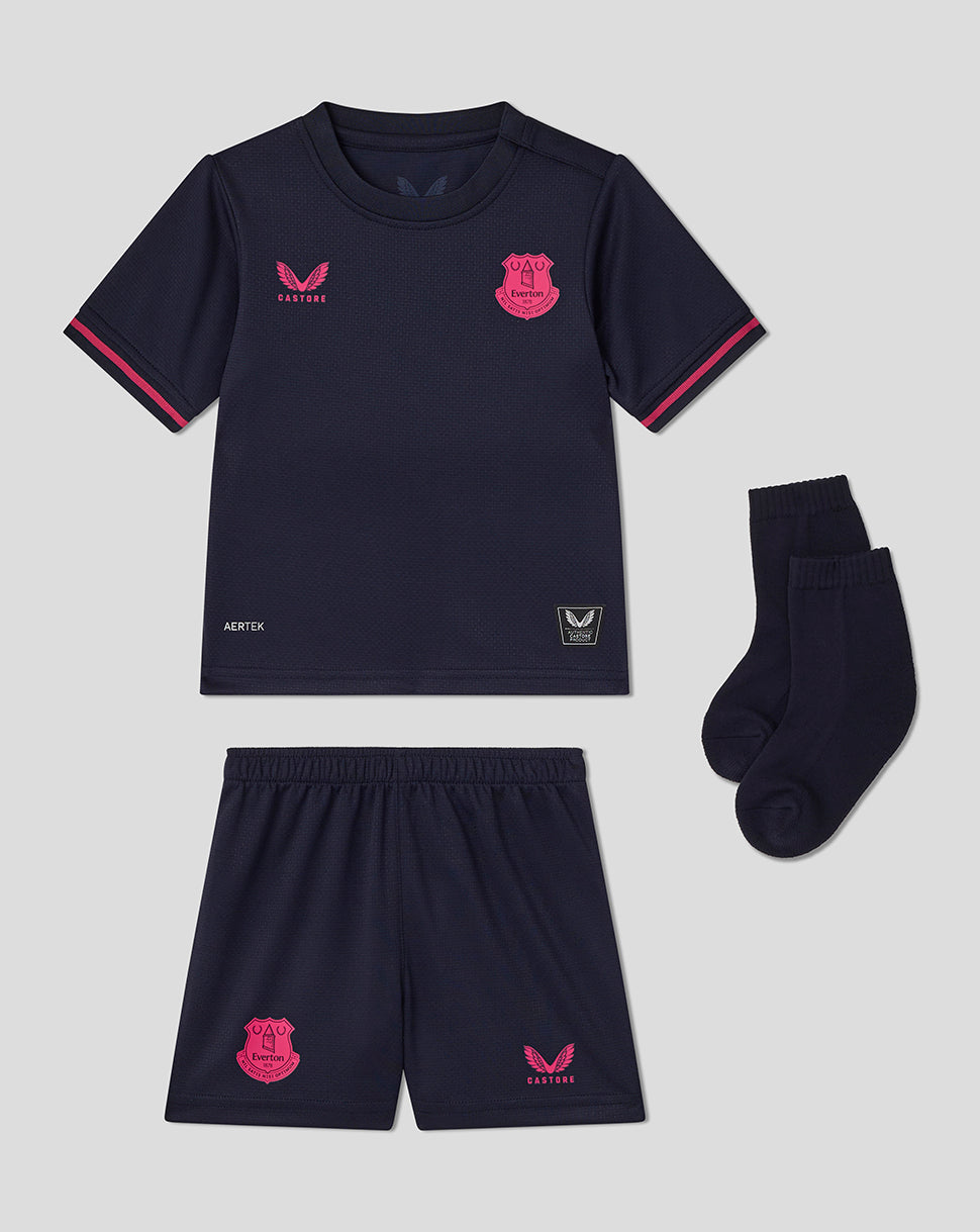 Navy sports outfit with pink accents on a gray background