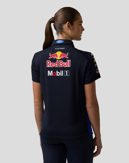 Person wearing a black polo shirt with Red Bull and Mobil 1 logos on the back.