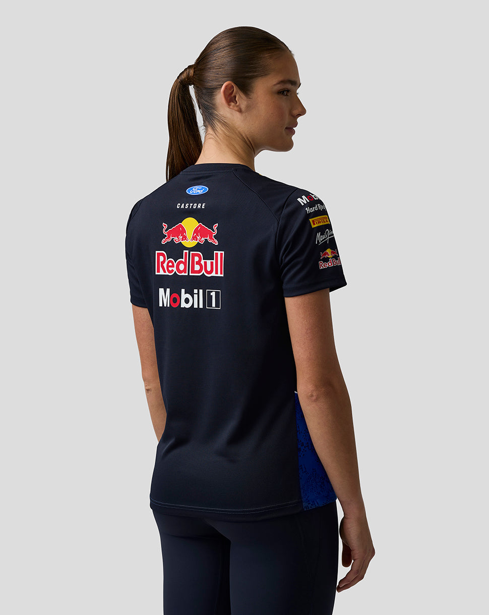 Person wearing a black sports jersey with Red Bull and Mobil 1 logos on a plain background