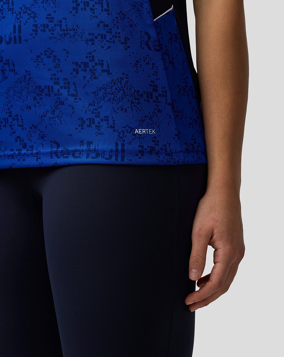 Blue patterned shirt with 'AERTEK' branding worn by a person on a white background