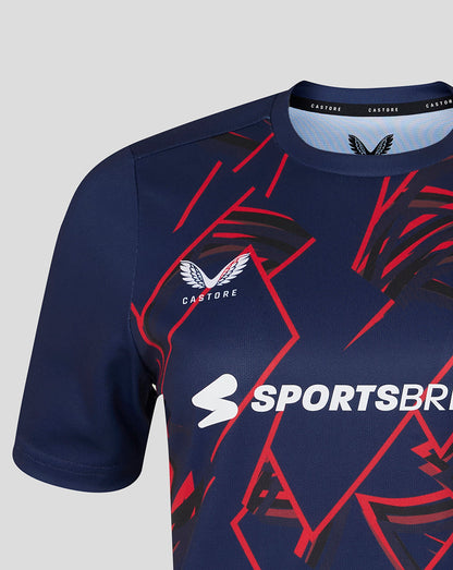 Navy sports jersey with red and white graphics and visible branding on a light gray background