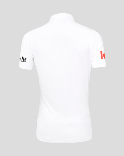 White polo shirt with branding on sleeves against a gray background