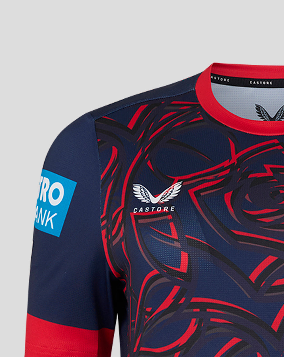 Navy and red sports jersey with intricate design and visible branding on a gray background