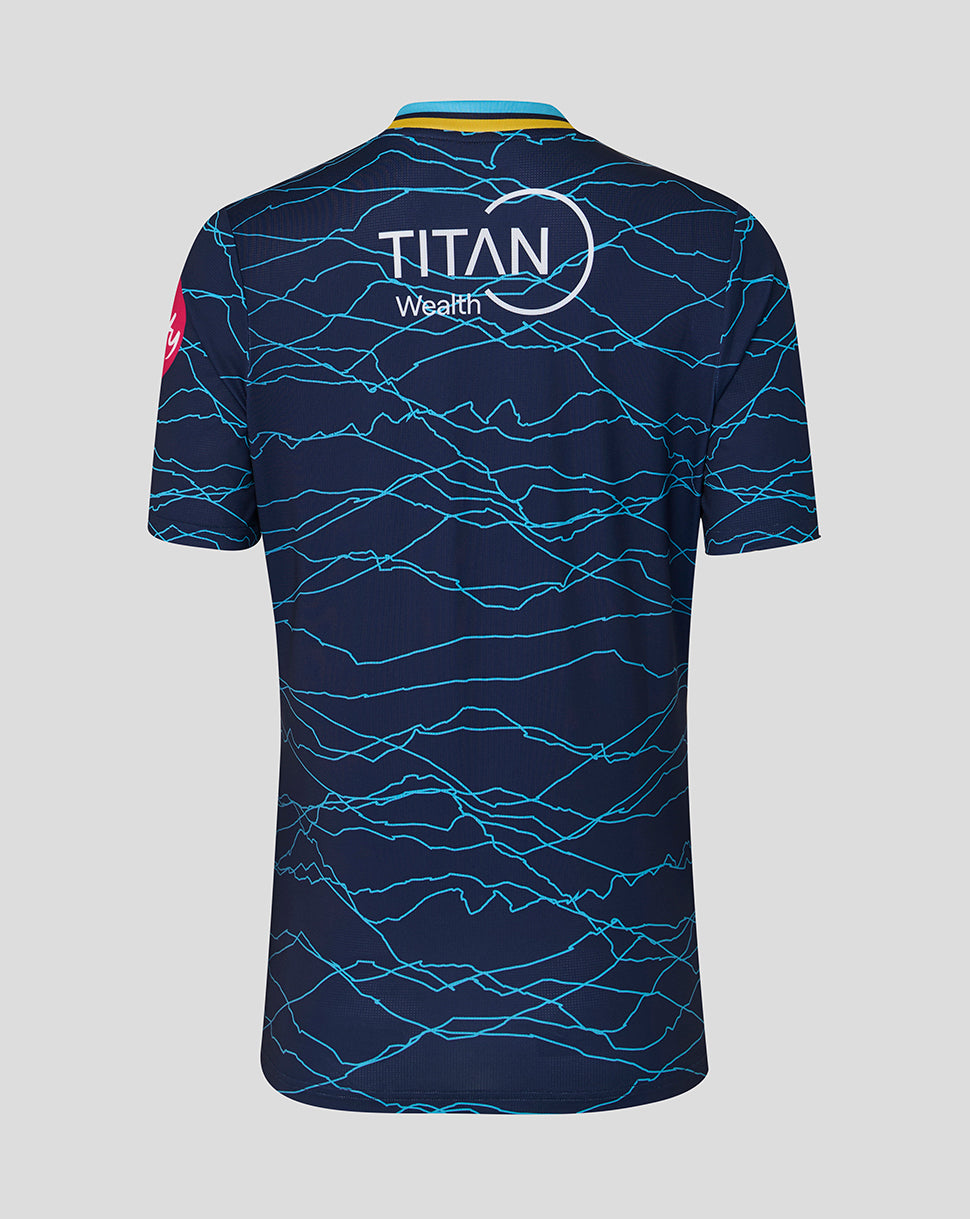 Navy blue sports jersey with blue lightning pattern and 'Titan Wealth' logo on a gray background