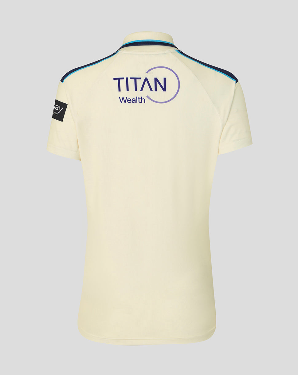 Light yellow polo shirt with 'Titan Wealth' logo on a gray background
