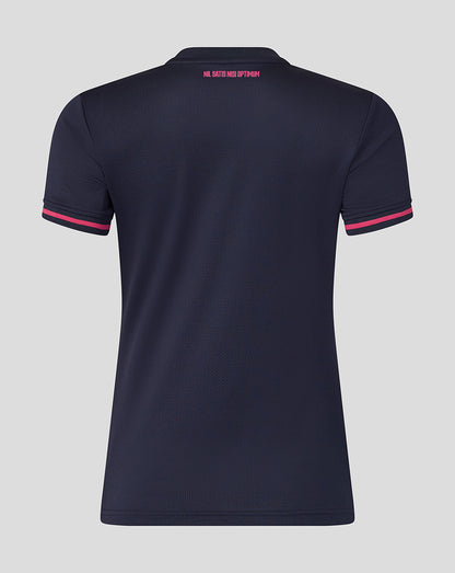 Navy blue polo shirt with pink accents on a gray background