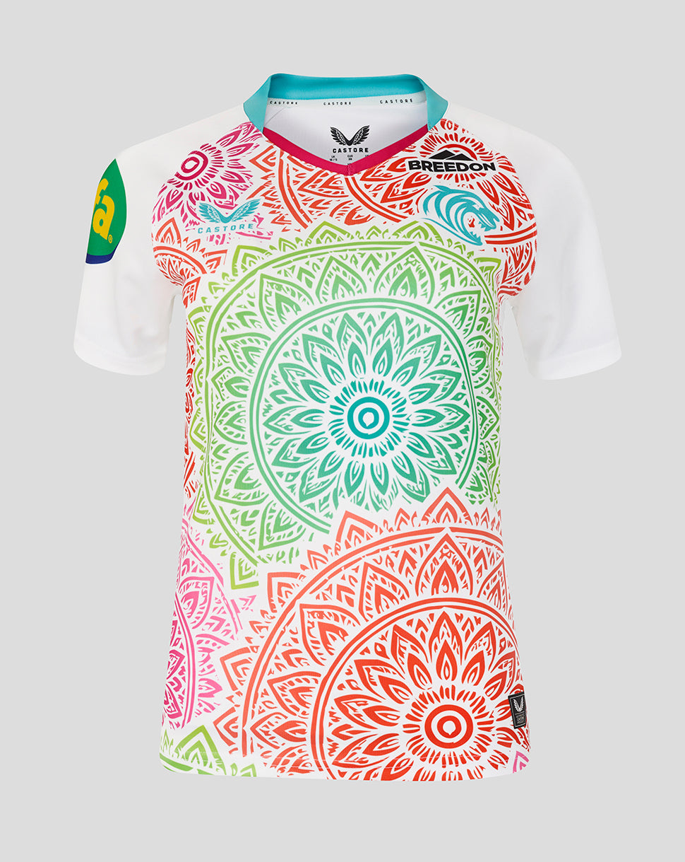 Colorful mandala-patterned shirt on a light gray background